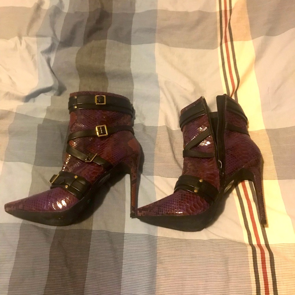 Scene purple snake skin high heel boots.